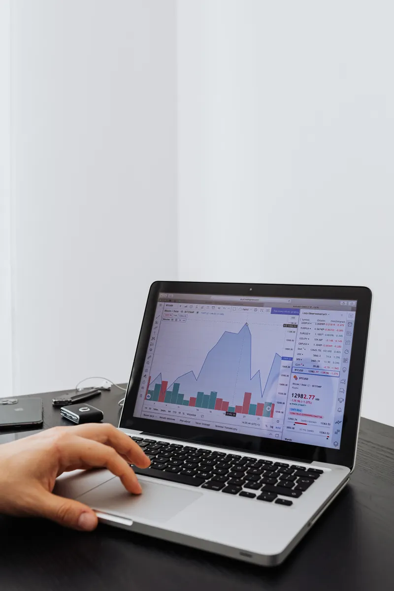 Analyst reviewing automation data and workflow metrics on a laptop