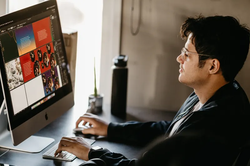 Designer working on marketing creative at a computer